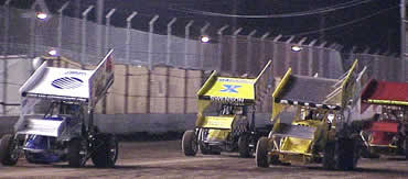 Billy Alley and Shane Stewart lead the feature field to the green flag 