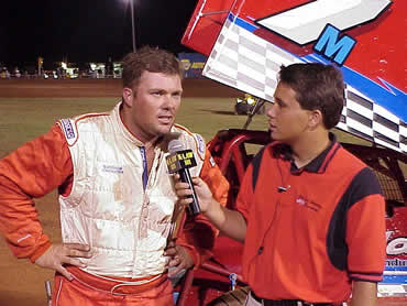 Kevin Ramey is interviewed by Lawton Speedway announcer Randy Ward 
