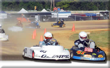 Scott Geesey (41) edges past Clark Simonton in 2-Cycle PDKA feature action Sunday at Selinsgrove in race four of the six-race PDKA Burris State Championship Series. 
