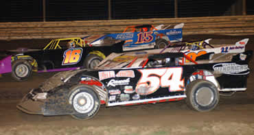 Dane Dacus, Bronson Berry, Mike Poynor, and Jamie Dacus make it four wide in the Topless 40 feature (Photo by Phil Bowden)