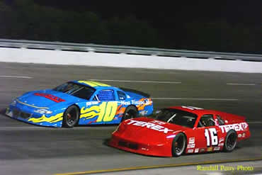 #16 Wayne Grubb gets under # 10 Darrell Sage as he moves through the field. 