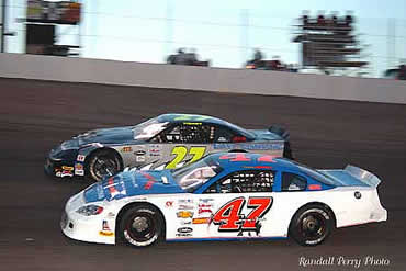 # 47 Stephen Gahagan and # 27 Lee Tissot  race close early in the race.