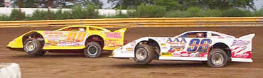 Randy Korte (00) and Terry English (96) battle out of turn 2 at Fayette County Speedway. 